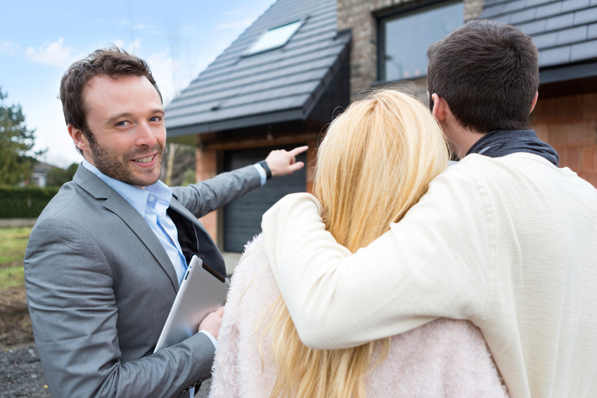 View of a Real estate agent shows details to customers